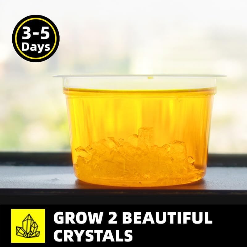 Clear container with yellow liquid and crystals, text indicating growth time and crystal growing kit branding.