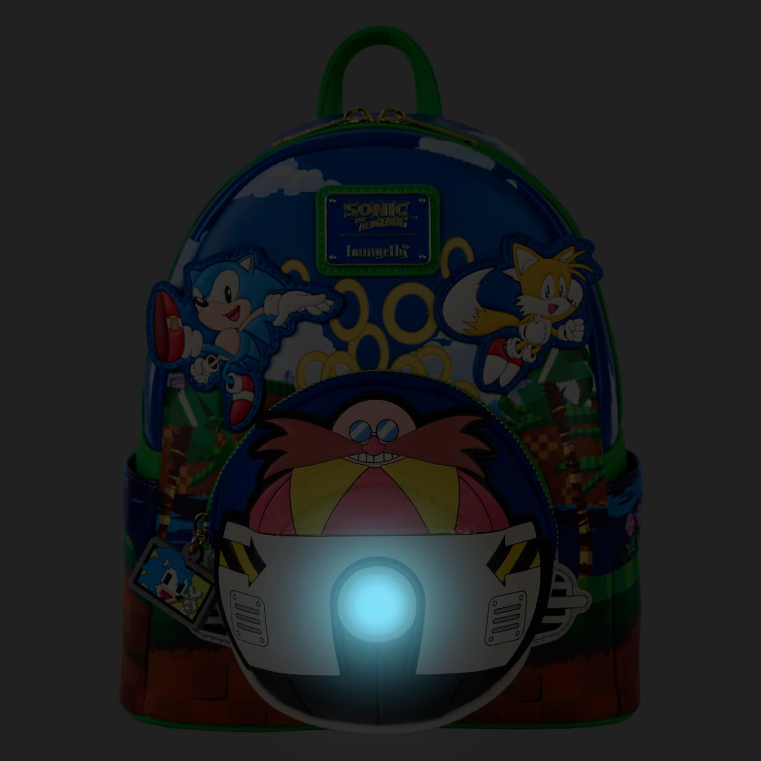 Backpack with cartoon characters and a glowing light on a dark background