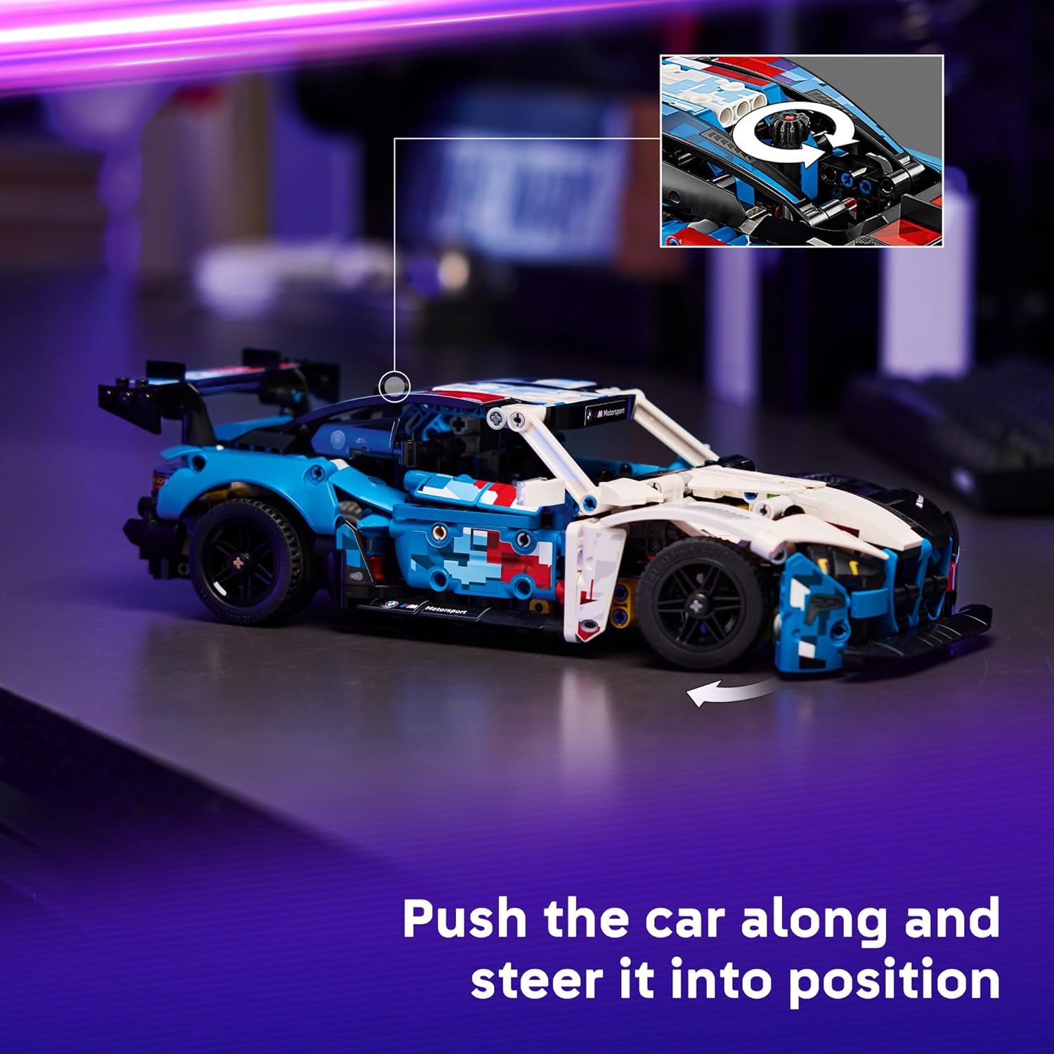 Toy car made of interlocking bricks on a reflective surface with a blurred background