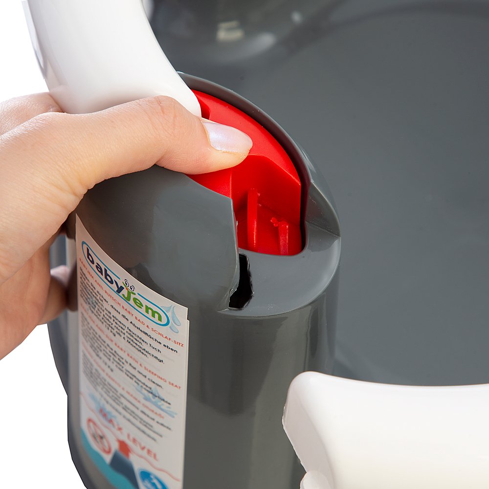 Person using a cleaning tool with a red handle on a gray surface, featuring the brand 'babyjem'.